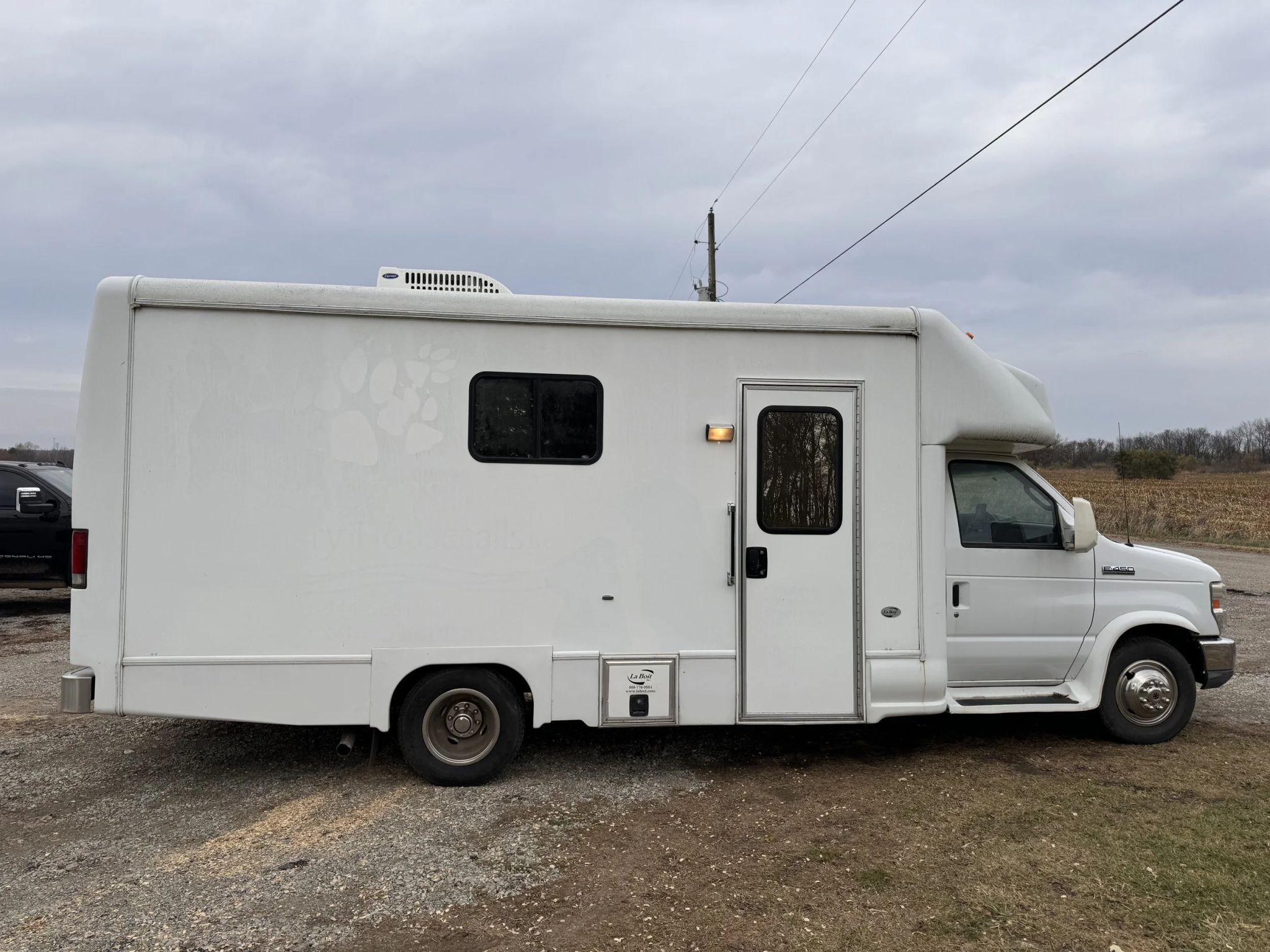 Interior of a mobile veterinary clinic with surgical and examination equipment, representing the challenges of managing multiple business operations.